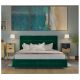 Łóżko tapicerowane zielonym welurem